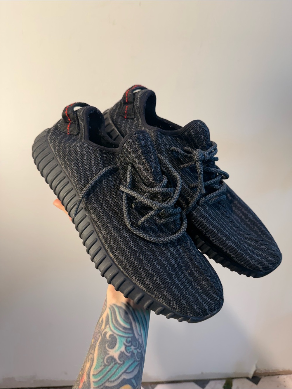 Selling a pair of Adidas Yeezy Boost 350 in the "Pirate Black" colorway, Size 9.